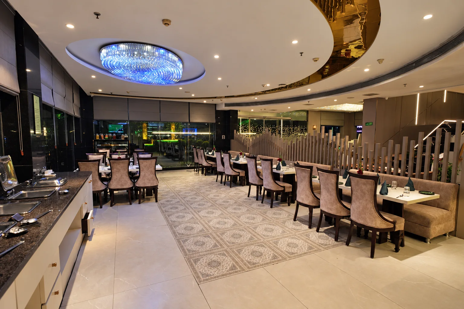 Evening restaurant ambience with chandelier lighting at Hotel Ranbirs