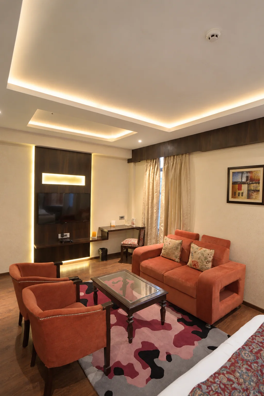 Sofa and coffee table in a Hotel Ranbirs guest room